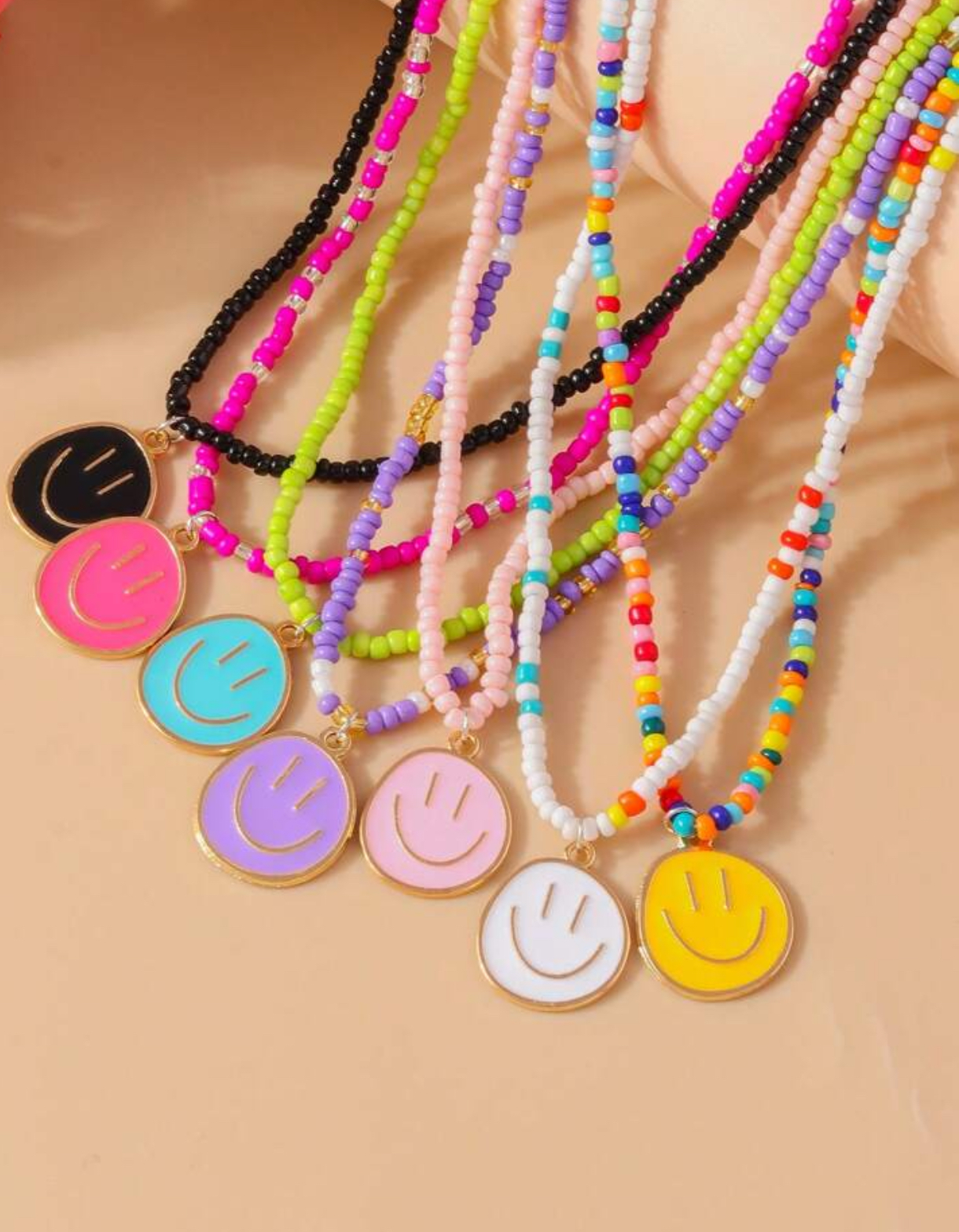 7 قلادات من الخرز بوجه مبتسم بسعر الجملة